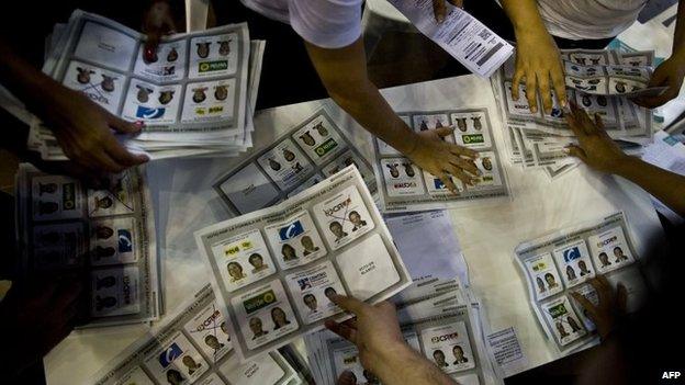 Electoral personnel count votes at a polling station after presidential elections on May 25, 2014, in Medellin, Antioquia department, Colombia