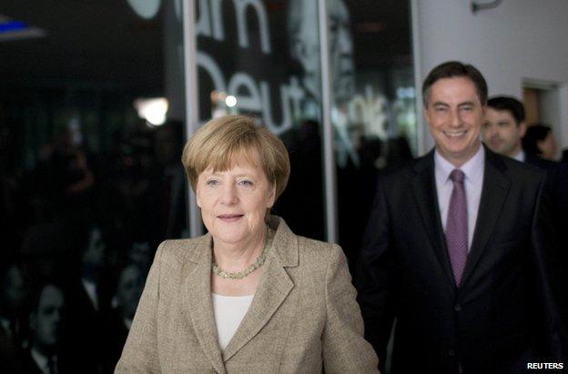 German Chancellor Angela Merkel arrives for a news conference in Berlin, 26 May