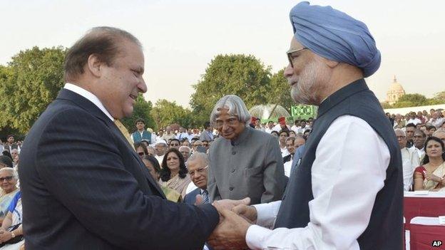 India"s outgoing Prime Minister Manmohan Singh, right, greets Pakistani Prime Minister Nawaz Sharif, left, as former Indian president A P J Abdul Kalam, center, watches during the inauguration of new prime minister Narendra Modi in New Delhi, India, Monday, May 26, 2014