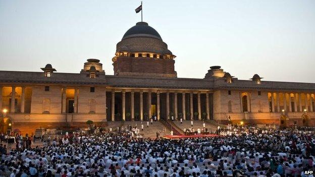 Modi's council of ministers take the oath of office in the forecourt during the swearing-in ceremony at the Presidential Palace in New Delhi on May 26, 2014.