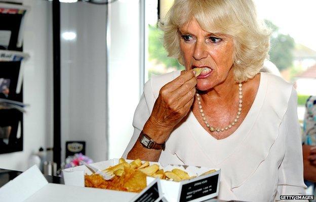 Camilla, Duchess of Cornwall samples haddock and chips in Bridlington in July 2013