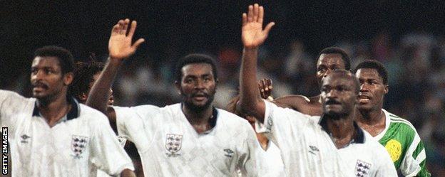 Roger Milla and his Cameroon team-mates wave to the crowd after their defeat by England