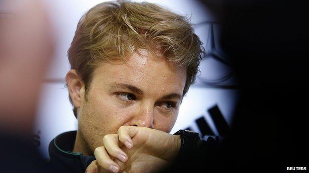 Mercedes Formula One driver Nico Rosberg of Germany reacts during a German national soccer team news conference in St. Martin, northern Italy, May 27