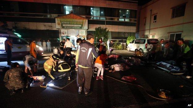 Firefighters rescue victims at a hospital in Jangseong, South Korea, Wednesday, May 28