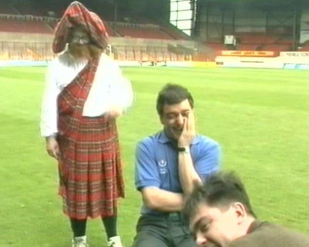 TV still of Neil Baldwin, Lou Macari and reporter