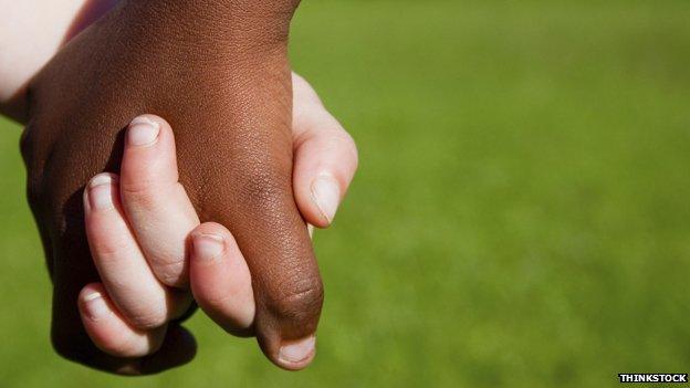 Black and white hands together