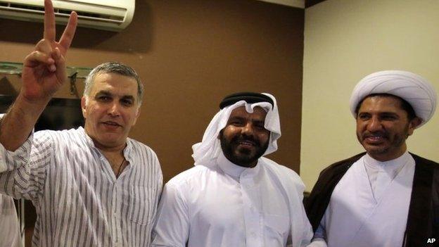 Nabeel Rajab (left) celebrates his release from prison with Osama Tamim (centre) and Sheikh Ali Salman (right) in Bani Jamra, Bahrain (24 May 2014)