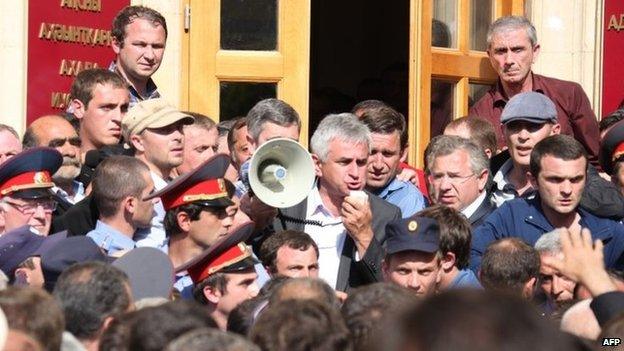 Opposition leader Raul Khadzhimba addresses protesters in front of the presidential office in Sukhumi, Abkhazia, 27 May