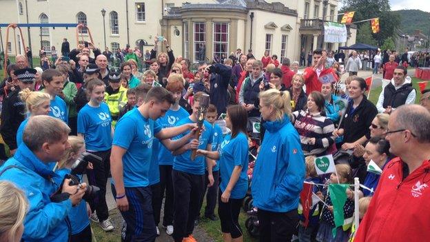 Queen's Baton Relay bearers and crowds at Y Plas in Machynlleth