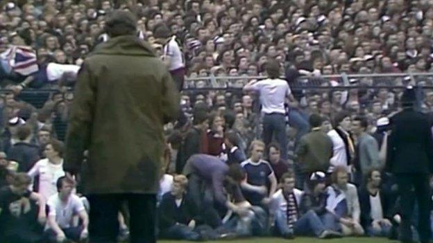 Tottenham Hotspur fans spilled on to the perimeter track at the Leppings Lane end of the ground