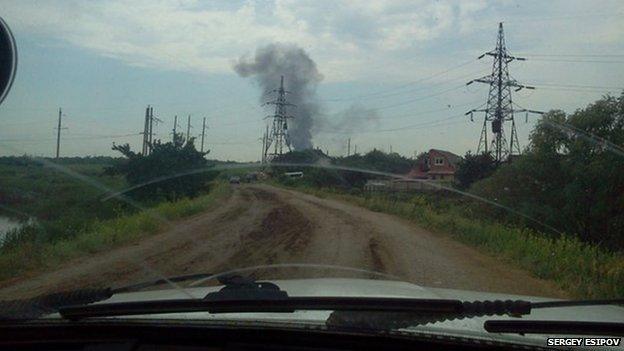 Smoke rising from the wreckage of a helicopter shot down by separatists near Sloviansk