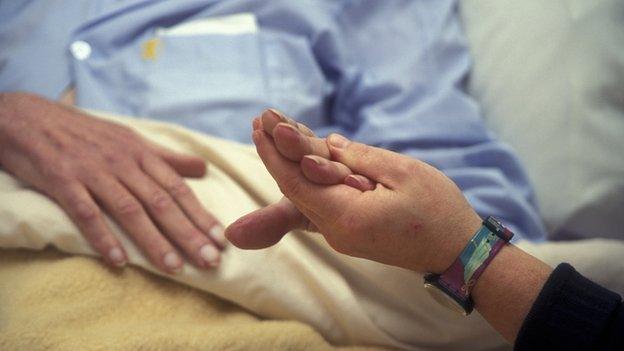 Picture of a hospice worker with a patient