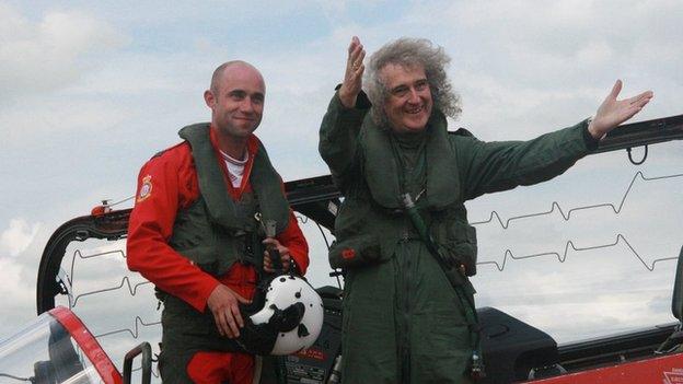 Flight Lieutenant Ben Plank with Queen guitarist Brian May