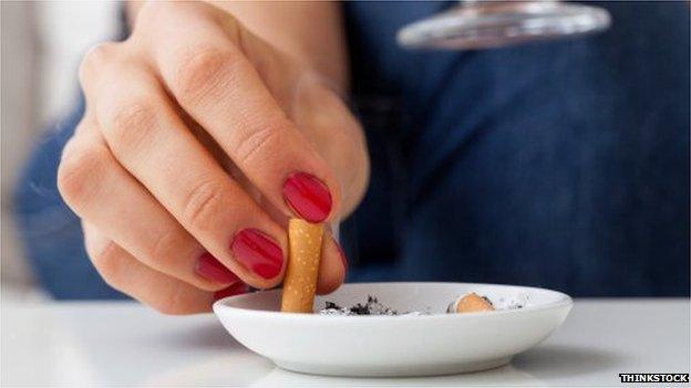 Woman stubbing out cigarette