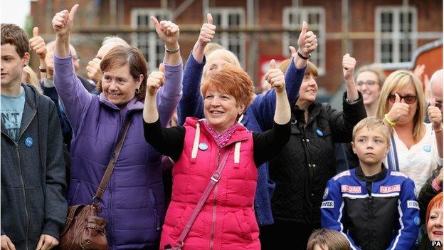 Crowds make the thumbs up sign