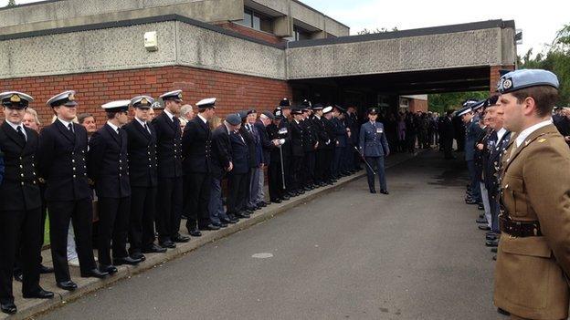 Military mourners at funeral