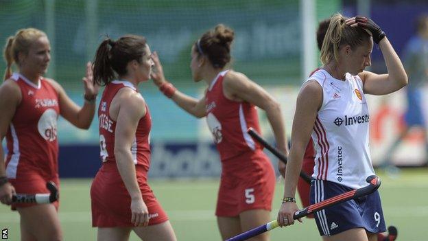 England"s Susannah Townsend (right) walks off after defeat against USA