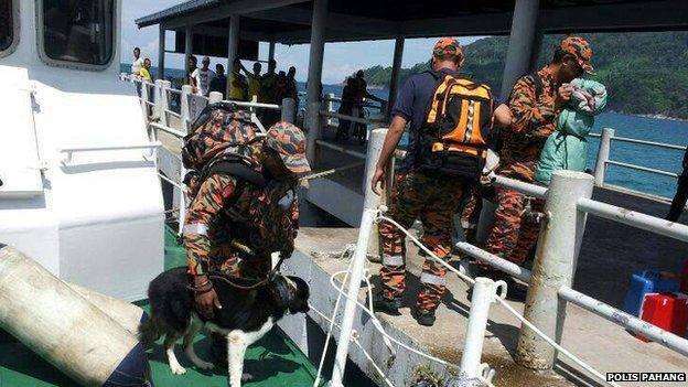 Rescuers in Malaysia