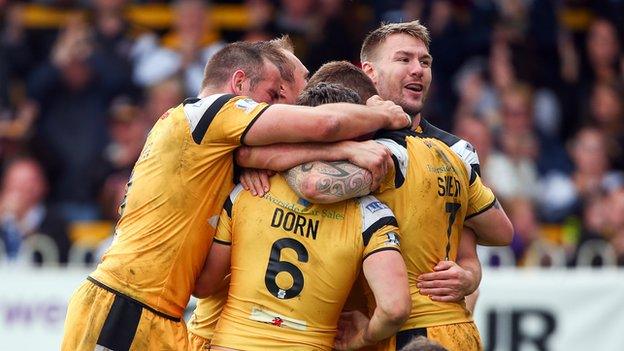 Castleford celebrate another Luke Dorn try