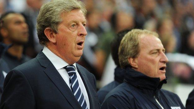 England coach Roy Hodgson sings the national anthem