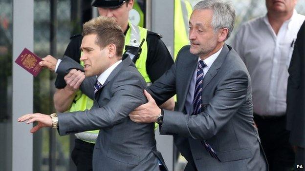 Simon Brodkin at Luton Airport