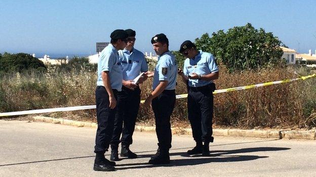 Portuguese police standing in front of a cordon