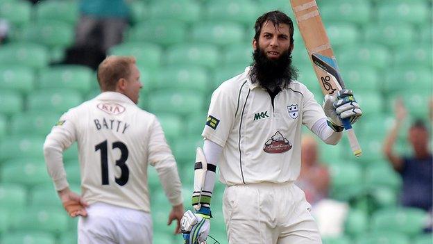 Worcestershire centurion Moeen Ali raises his bat at The Oval