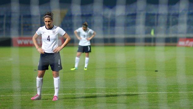 Fara Williams through the goal net