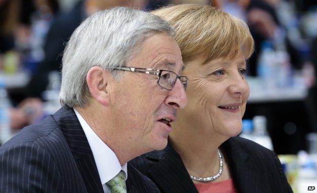 Jean Claude Juncker with German Chancellor Angela Merkel (5 April 2014)