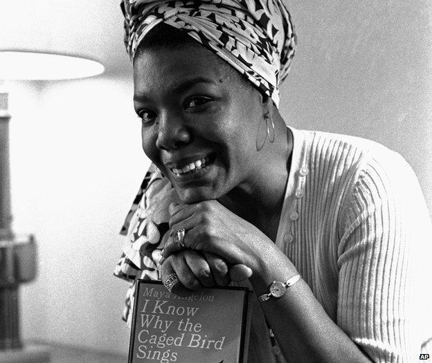 Maya Angelou poses with a copy of her book I Know Why the Caged Bird Sings in 1971 in Los Angeles, US