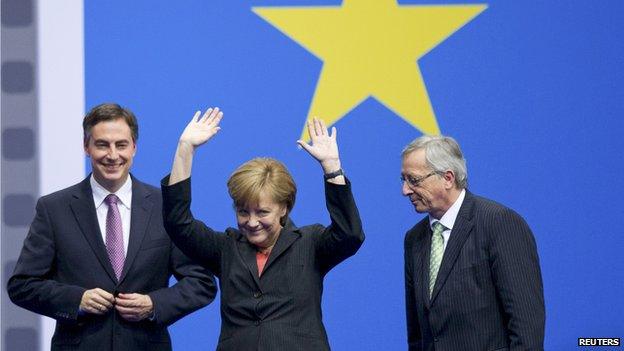 Jean-Claude Juncker (right) with Chancellor Merkel at CDU congress, 5 Apr 14