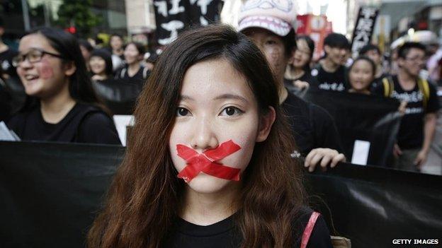 Pro-democracy activists march to mark the 25th anniversary of Tiananmen Square massacre, on 1 June 2014 in Hong Kong