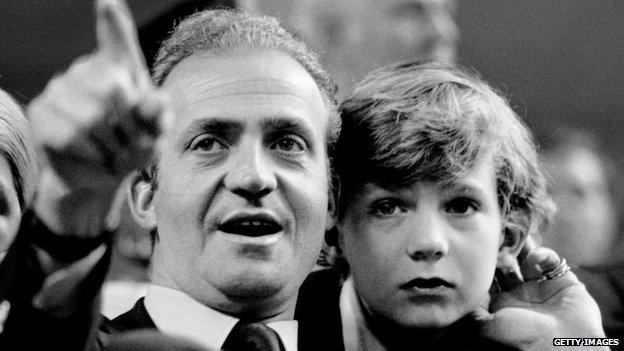 Juan Carlos, King of Spain, and his son the Prince Felipe watch a tennis match in Madrid, Spain in 1977