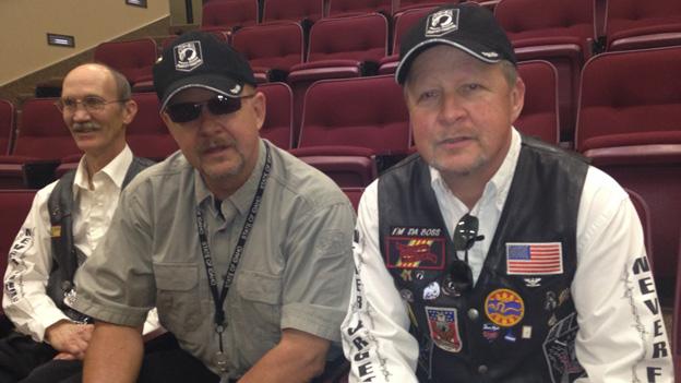 Three men in motorcycle gear