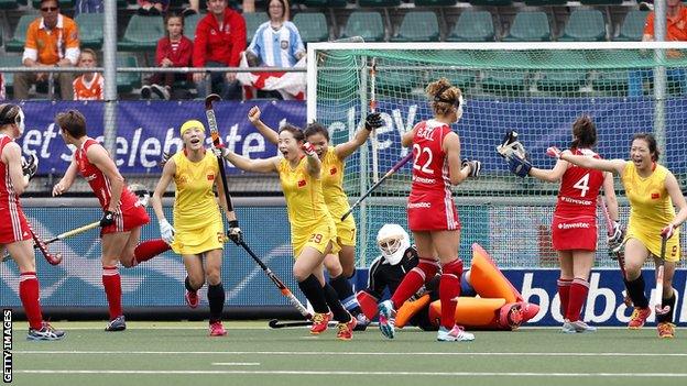 China celebrate scoring against England in the Hockey World Cup in the Netherlands