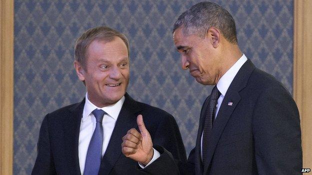 US President Barack Obama (R) gives a thumbs-up as he arrives with Polish Prime Minister Donald Tusk to speak to the press following a meeting in Warsaw, Poland, on June 3