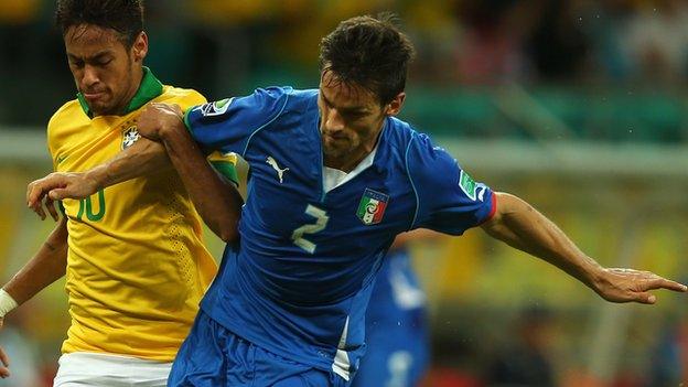 Neymar of Brazil battles with Italy's Christian Maggio during the 2013 Confederations Cup