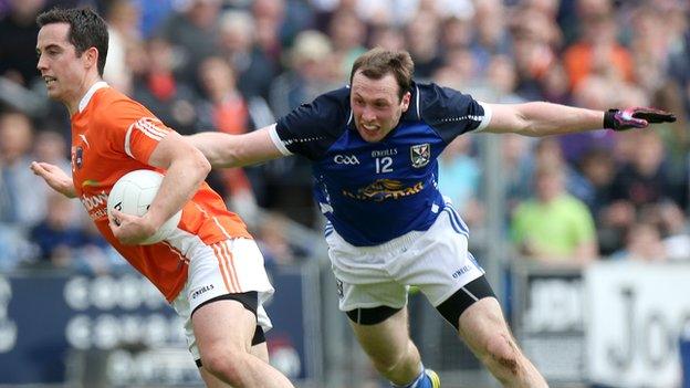 Aaron Kernan battles with Cavan's Fergal Flanagan in last year's Ulster SFC clash