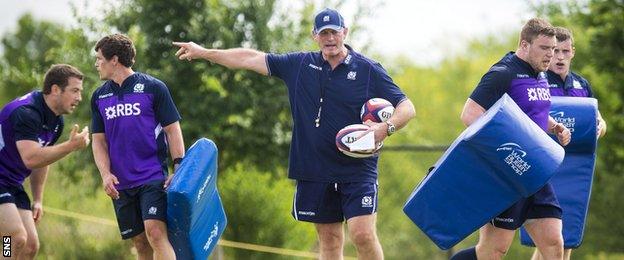 Head coach Vern Cotter puts the Scotland players through their paces in training