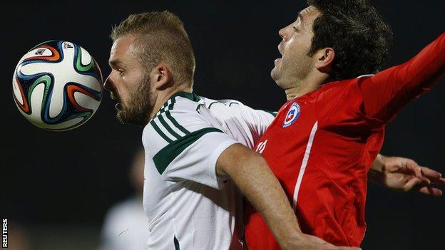 Northern Ireland's Ryan McLaughlin attempts to hold off Jose Rojas of Chile