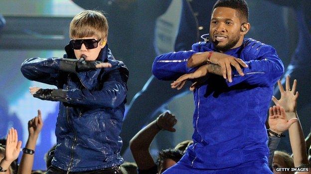 Justin Bieber and Usher on stage