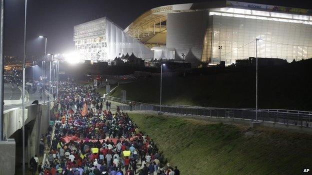 Members of Brazil's Homeless Workers" Movement (MTST) block a road during a protest in front of Sao Paulo's World Cup stadium on 4 June, 2014