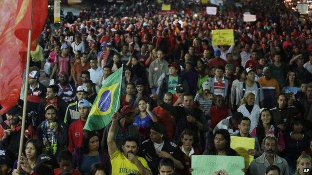 Members of the Homeless Workers Movement march during a protest demanding better public services in Sao Paulo on 4 June, 2014