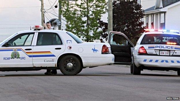 Police take cover in Moncton. 4 June 2014