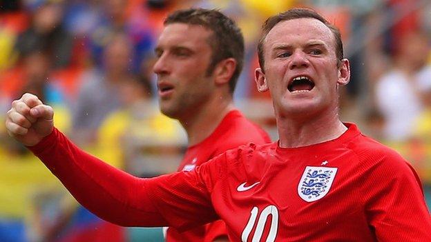 Wayne Rooney (right) in action for England