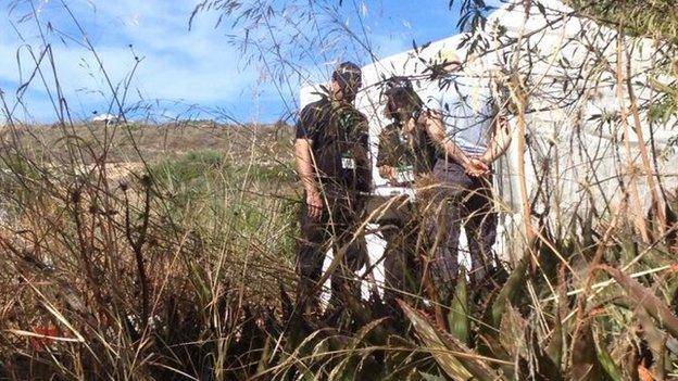 Officers at the search site in Praia de Luz