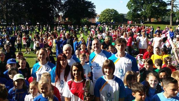 Crowds with the baton-bearers at Tonbridge Castle