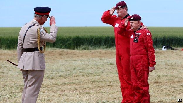 Prince Charles saluting Jock Hutton before his parachute jump