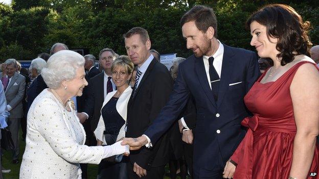 The Queen shaking hands with Sir Bradley Wiggins