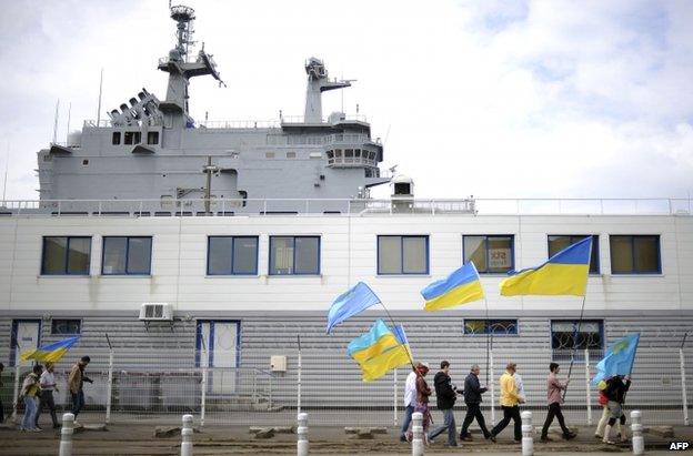 Pro-Ukrainian protesters near the French-built Vladivostok warship to be sold to Russia in Saint-Nazaire, western France, 1 France